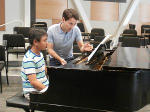 Music Director, Dr. David Rentz working with youth soloist, Aldric Gozon, to prepare for the September 25, 2016 concert.